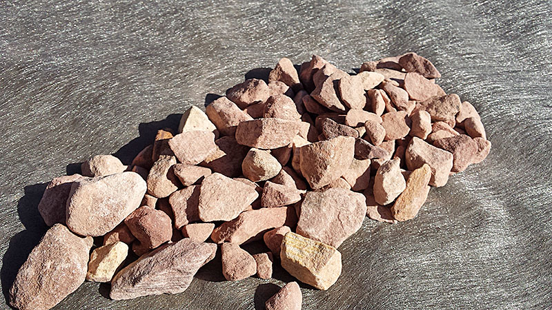 Weed Barrier with rocks holding it down